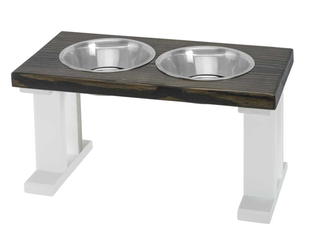 Farmhouse 2 Bowl Elevated wooden pet feeder with two stainless steel bowls on white legs.