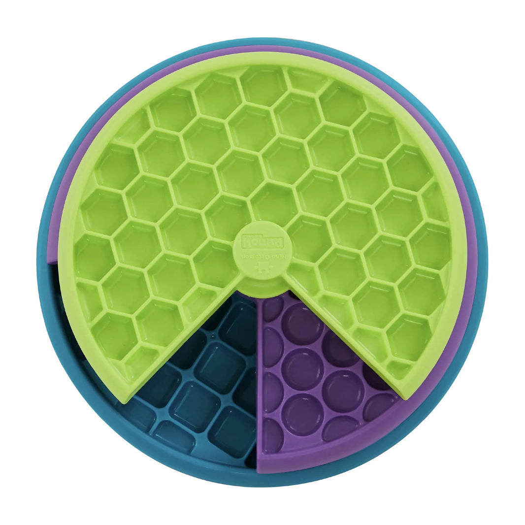 Nina Ottosson interactive multicolored dog puzzle toy with three spinning layers for treats and mental stimulation