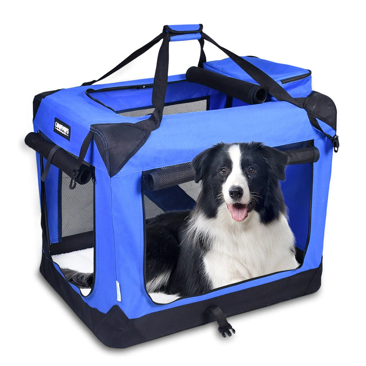 Blue soft-sided pet travel crate with mesh windows, three entry doors, carrying straps, and a black and white dog inside
