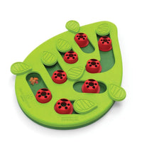 Green leaf-shaped Catstages Puzzle Toy with red peg covers and hidden treat compartments for interactive cat play and feeding