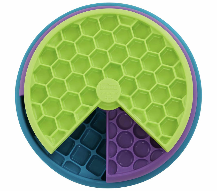 Nina Ottosson interactive multicolored dog puzzle toy with three spinning layers for treats and mental stimulation