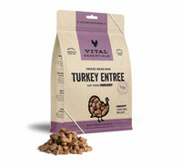 Vital Essentials freeze-dried turkey cat food in a bag with kibble pieces spilled on the side